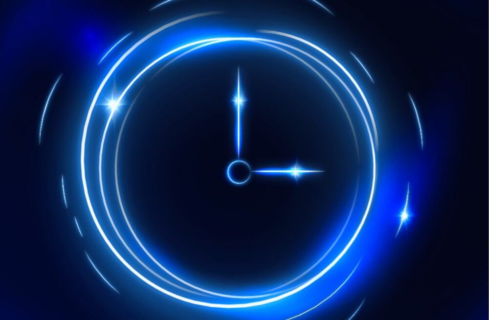 A digital clock made of neon blue lights
