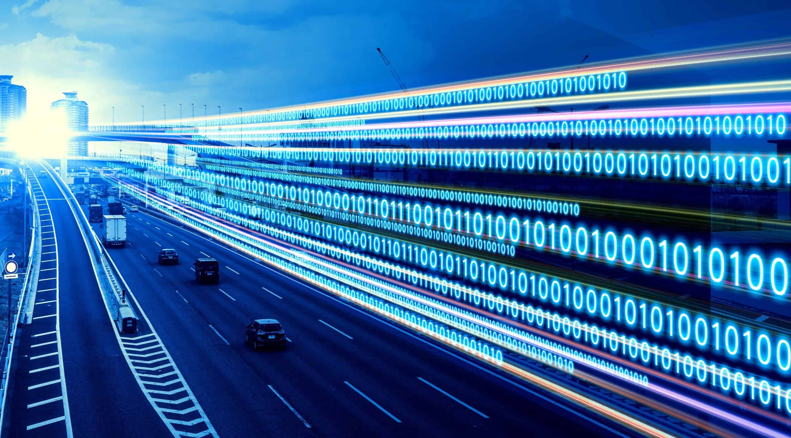 Binary code streaming on a highway symbolizing the transfer of digital information