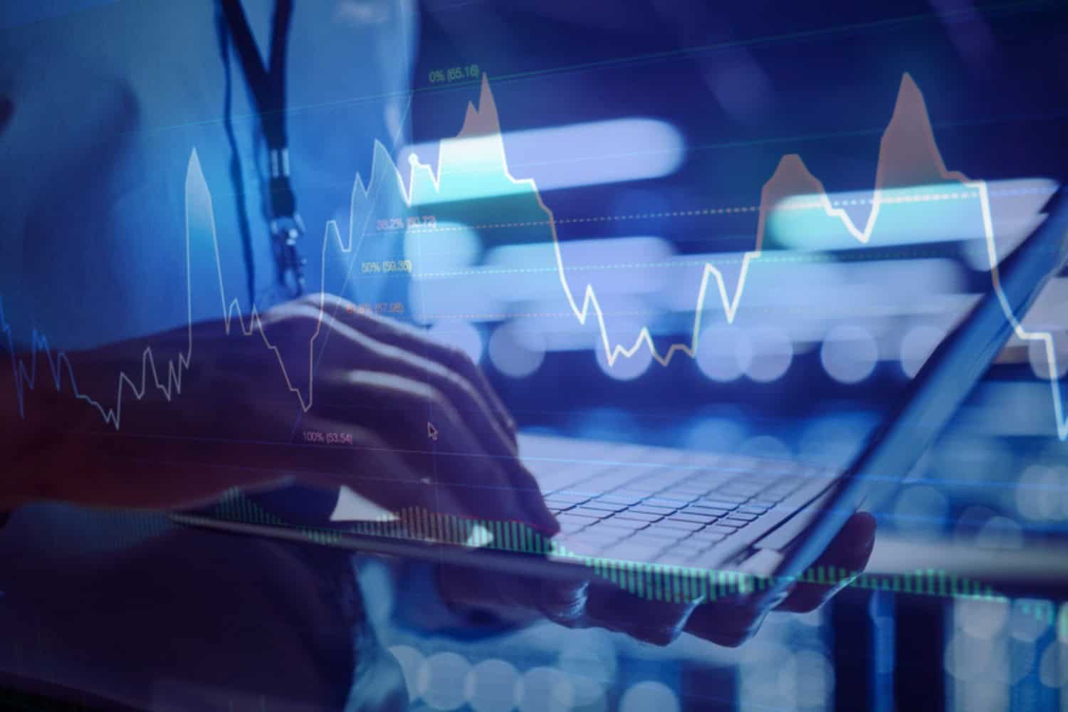 A man reviewing digital analytics on a laptop computer