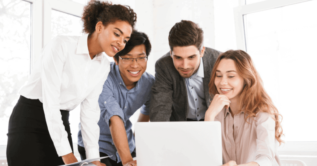 A team of transportation professionals reviewing computer data in an office