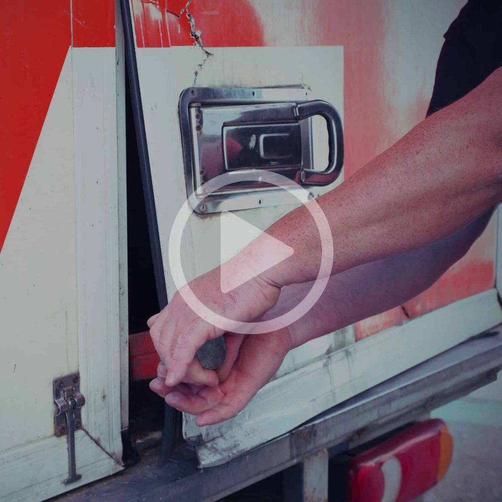 Reliable delivery truck loading and unloading with hand securing cargo, logistics transportation, freight vehicle operation.