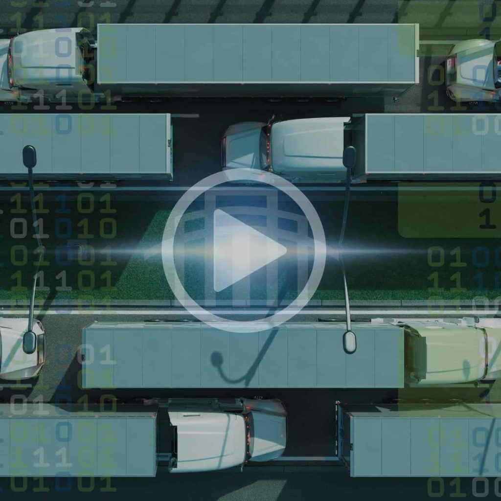 Connected commercial trucks utilizing IoT fleet management technology for data-driven logistics solutions.