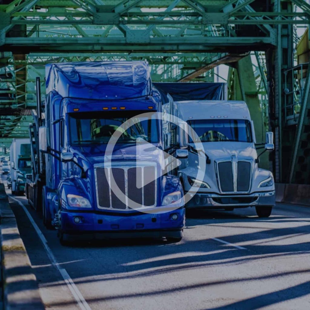 Blue semi-trucks parked under industrial green bridge at port efficient freight transportation logistics modern freight trucks and infrastructure for supply chain management image of commercial trucks at a busy industrial shipping yard relevance.