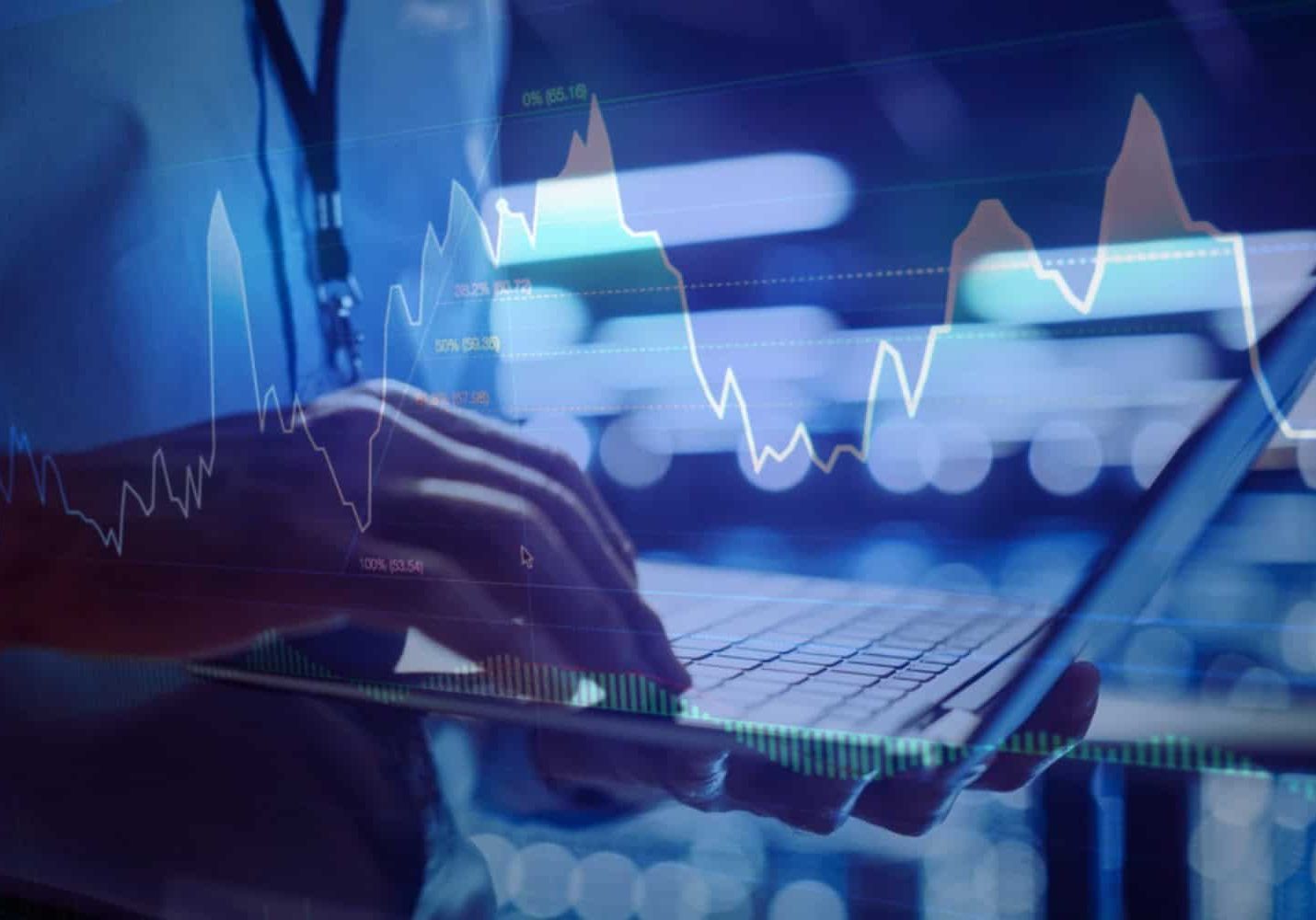 A man reviewing digital analytics on a laptop computer